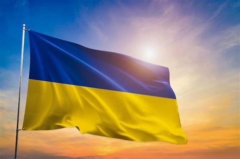 Premium Photo Ukraine National Flag Waving In Beautiful Clouds