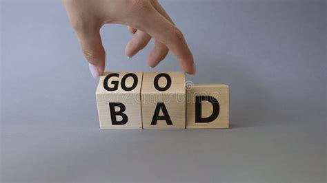 Good Vs Bad Symbol Businessman Hand Turns Cubes And Changes Word Bad