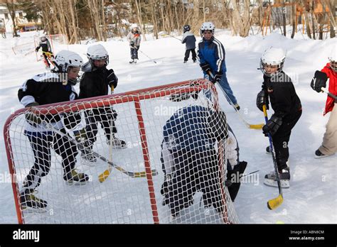 Children Playing Hockey Stock Photo - Alamy