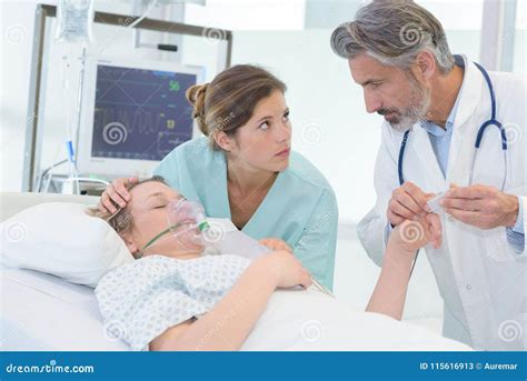 Doctor and Nurse with Patient in Hospital Stock Image - Image of ...