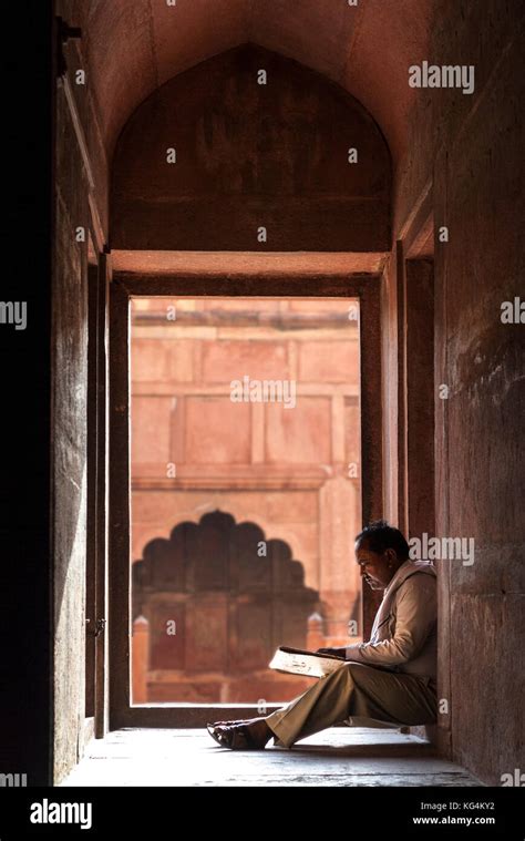 indian man reading high resolution stock photography  images alamy