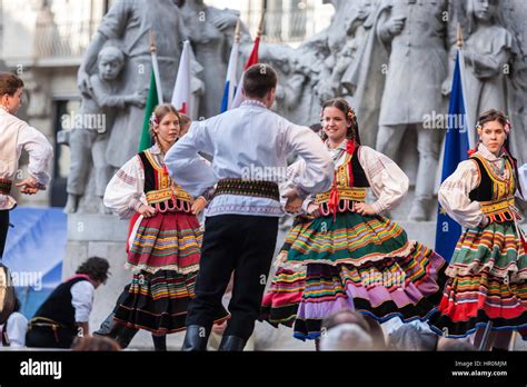 Boys And Girls In Folk Costume Performing A Hungarian Folk Dance In