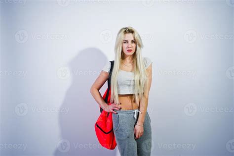 Blonde Sporty Girl With Big Sport Bag Posed At Studio Against White Background Stock