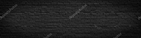 Panorama Of Black Brick Wall For Site Caps As Background Stock Photo