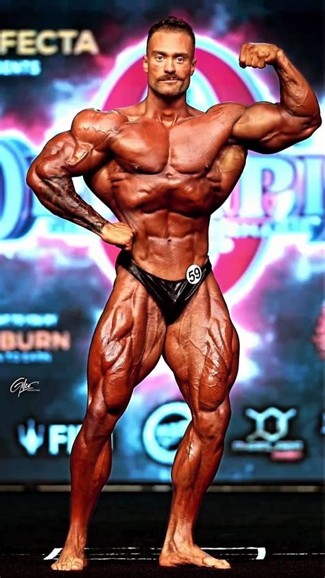 A Bodybuilding Competitor Posing For The Camera