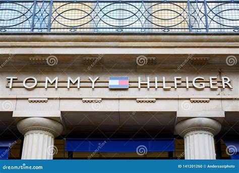 Tommy Hilfiger Fashion Luxury Store Sign in Paris, France Editorial ...