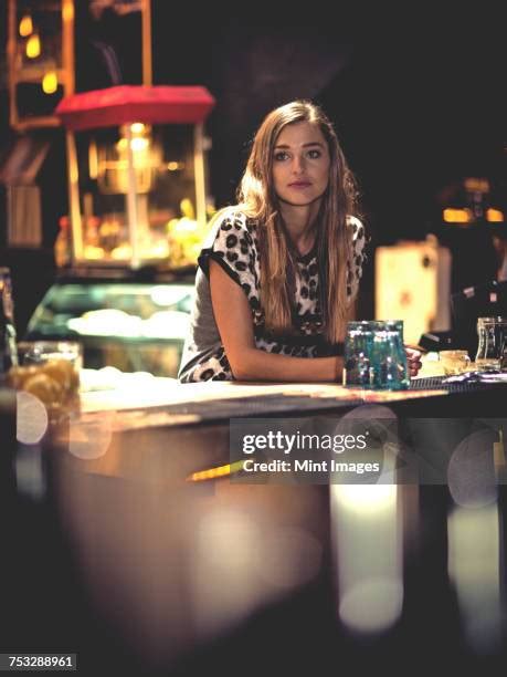 Woman Leaning On Bar Photos And Premium High Res Pictures Getty Images