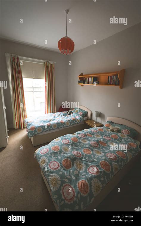 Bed In Empty Bedroom Stock Photo Alamy