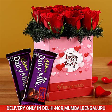 Buysend Red Roses Arrangement Cadbury Fruit N Nut Online Fnp