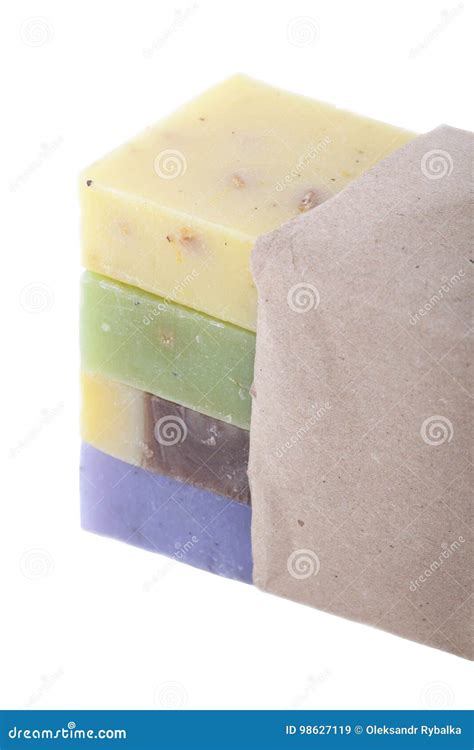 Four Handmade Soaps In A Paper Package Isolated On White Background