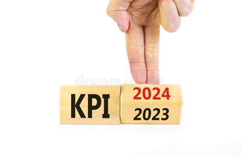 Kpi Key Performance Indicator Symbol Businessman Turns Wooden Cubes