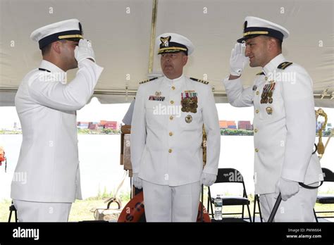 NEW YORK Coast Guard Lt Cmdr Paul Windt Left Salutes Lt Keith