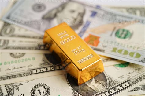 Gold bars on US dollar banknote money, finance trading investment ...