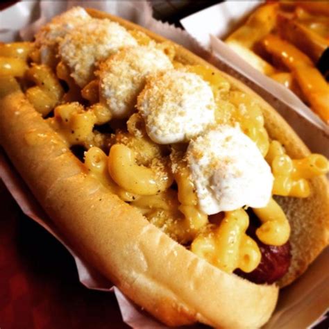 A Hot Dog With Macaroni And Cheese On It