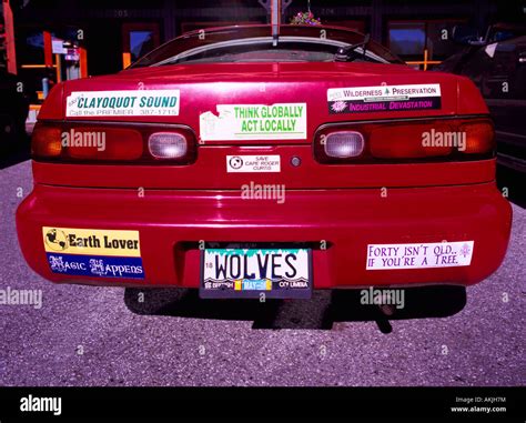 Environmental Bumper Stickers on a Red Car Stock Photo - Alamy