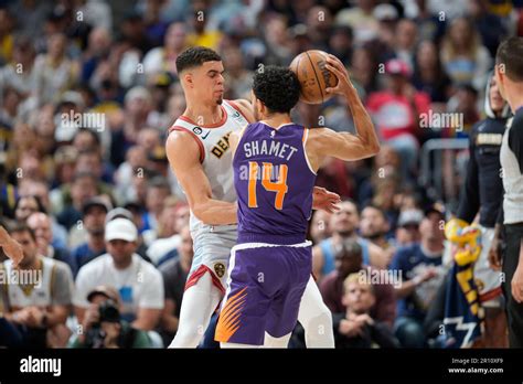 Phoenix Suns Guard Landry Shamet 14 And Denver Nuggets Forward