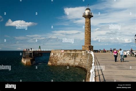 Whitby harbour lighthouse, Yorkshire, UK Stock Photo - Alamy