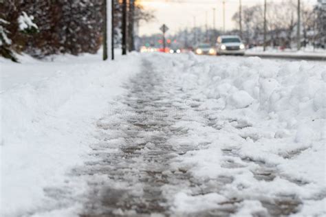 Winter Road With Melting From Salt Snow Close Up Of Sidewalk With