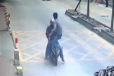 Watch Phone Thief Knocked Off Scooter By Victims Jump Kick