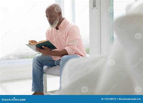 Man Reading A Book Stock Image Image Of Carpet Mature 152798975