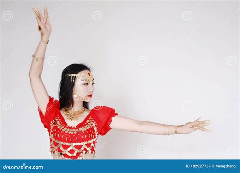 Graceful Asian Chinese Belly Dancer In White Background Stock Image