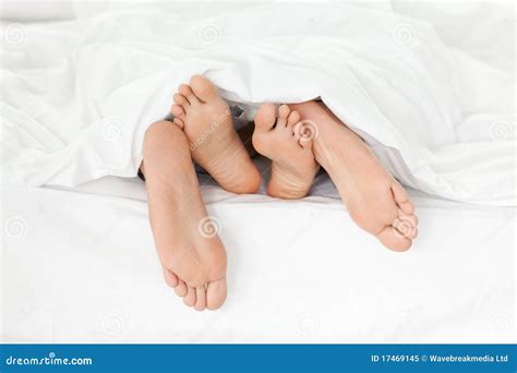 Close Up Of Couple S Feet In Their Bed Stock Image Image Of Foot