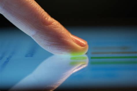 close   hand  computer touch screen premium photo