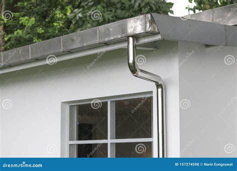 Rain Gutters and Pipes for Drainage of Rainwater from the Roof. Stock ...