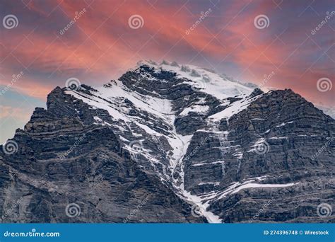 Stunning Sunset Illuminates The Snow Capped Peaks Of Robson Mountain In