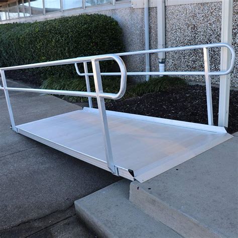 A White Ramp Sitting In Front Of A Building