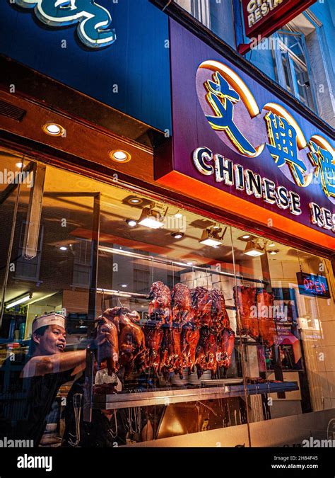 Crispy Duck Window Display Chinatown Soho London Chef Arranging Rows Of