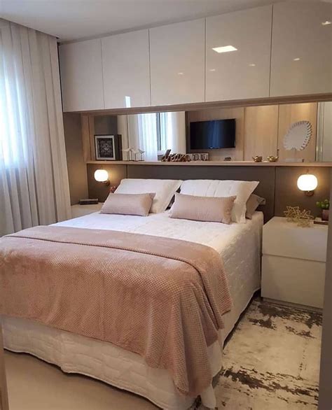 A Bedroom With A Large Bed And White Walls