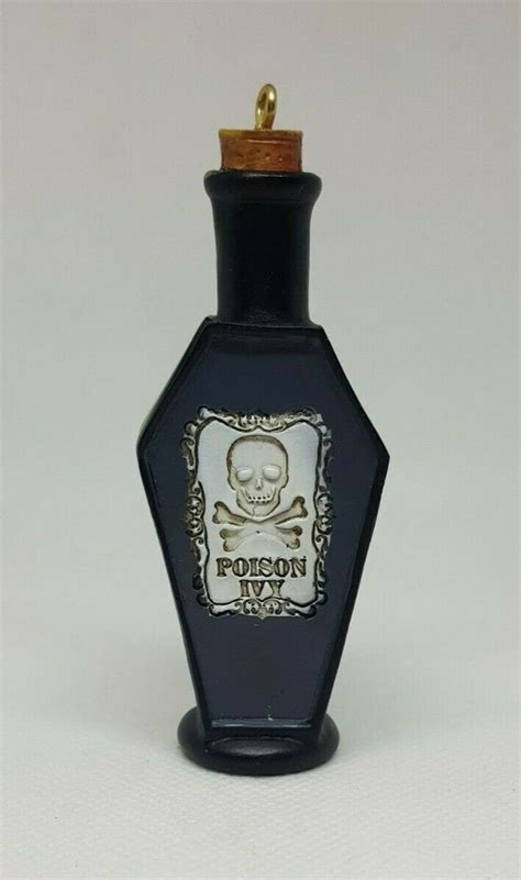 A Black Bottle With A Skull And Crossbones On The Top Is Shown In Front Of A White Background