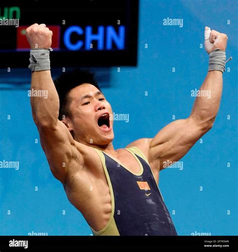 Chinas Lu Xiaojun Reacts In The Clear And Jerk Of The Mens Group A 77