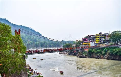 Lakshman Jhula Suspension Bridge In Rishikesh With Boats In Ganga River ...