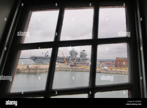 A View Of The Royal Navy Flagship Hms Queen Elizabeth Through A Window