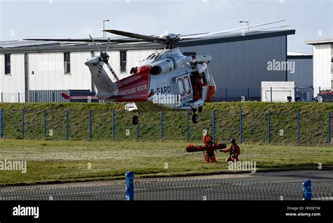 Hm Coastguard Helicopter Portland Dorset Taking Part In A Patient