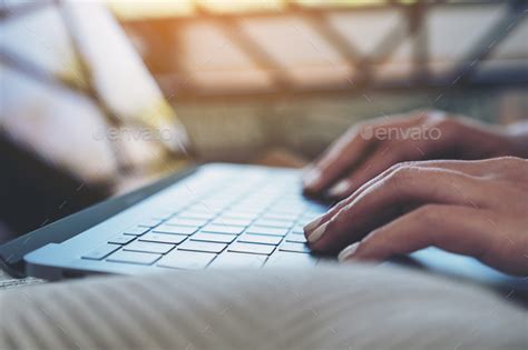 Closeup Image Of Woman S Hands Using And Typing On Laptop Keyboard