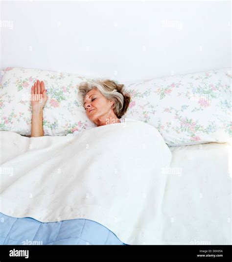 Senior Woman Sleeping Bed Home Stock Photo Alamy