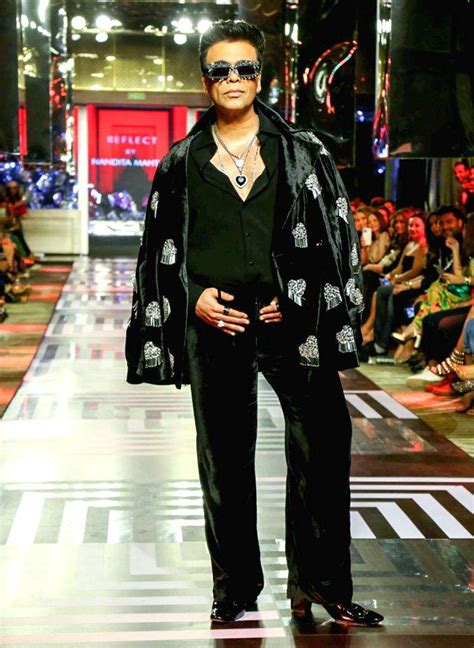 Filmmaker Karan Johar walks the ramp during a fashion show