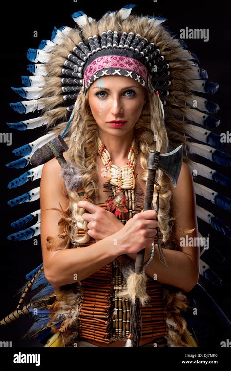 Beautiful Woman In Native American Costume With Feathers Stock Photo