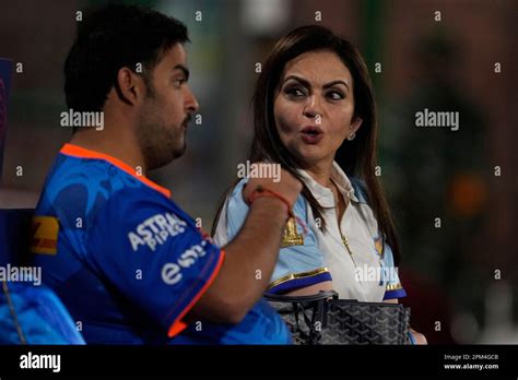 Nita Ambani and her son Anant Ambani talk as they watch the Indian ...