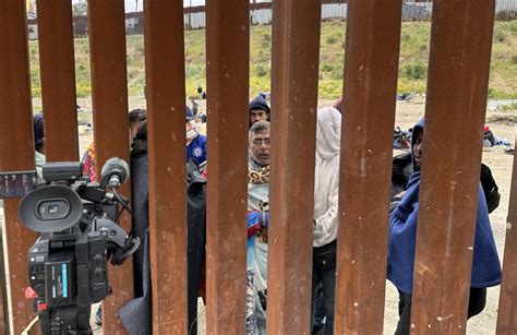 Migrants amassing on U.S. territory between border walls in San Diego