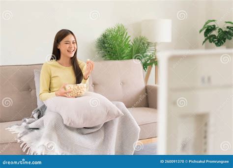 Relaxation Concept Young Woman Is Eating Popcorn While Sitting On The