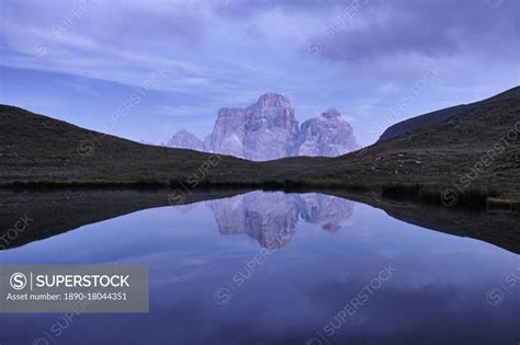 Reflection Of Pelmo Mountain In The Baste Lake During Blue Hour