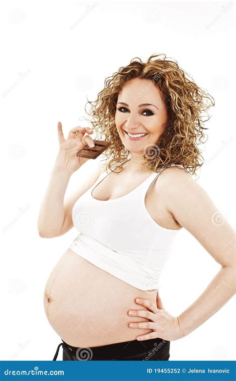 Une Femme Enceinte Mange Un Bar De Chocolat Photo Stock Image Du Cheveu Abdomen 19455252