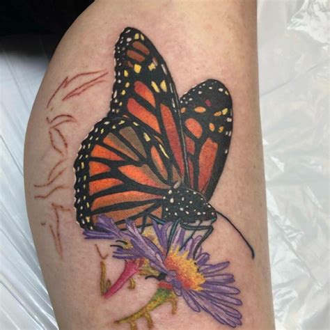 Monarch Butterflies On Flowers Tattoo