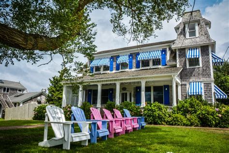 Classic Cape Cod House With Sunchairs Lined Up Editorial Stock Photo