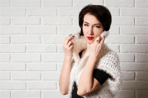 Beautiful Woman Posing Near White Brick Wall Background Stock Image