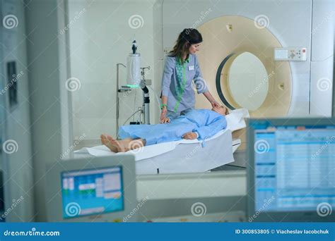 Experienced Radiologic Technologist Is Preparing Client For Computed